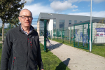 Councillor James MacLaren standing outside Dargavel Primary School